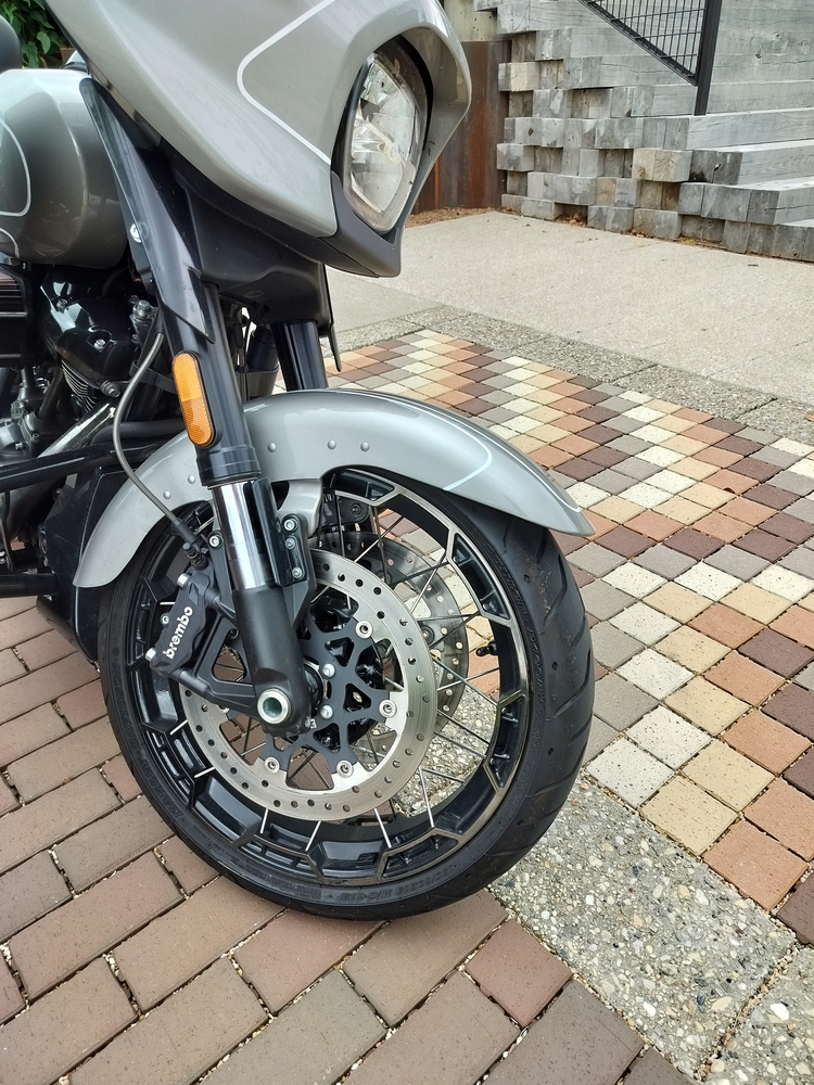 Modern Harley-Davidson CVO spoked wheel with trapezoidal castings where the spokes lace to the rim.