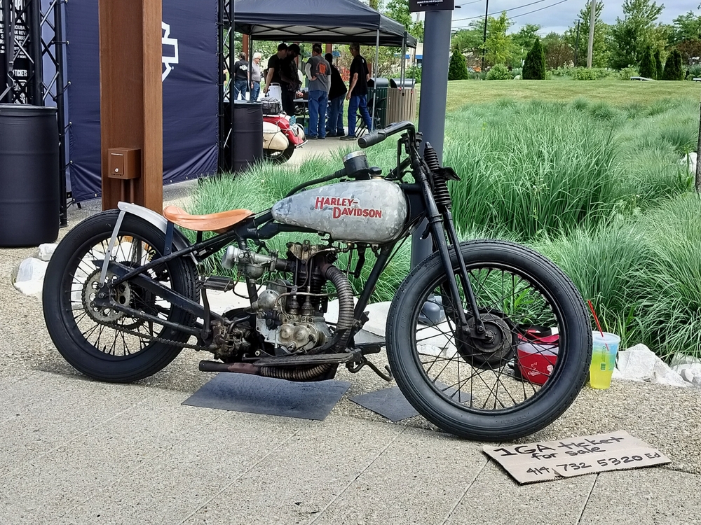 Pre-war Harley-Davidson single cylinder race bike. Grey tank, brown seat, black frame.