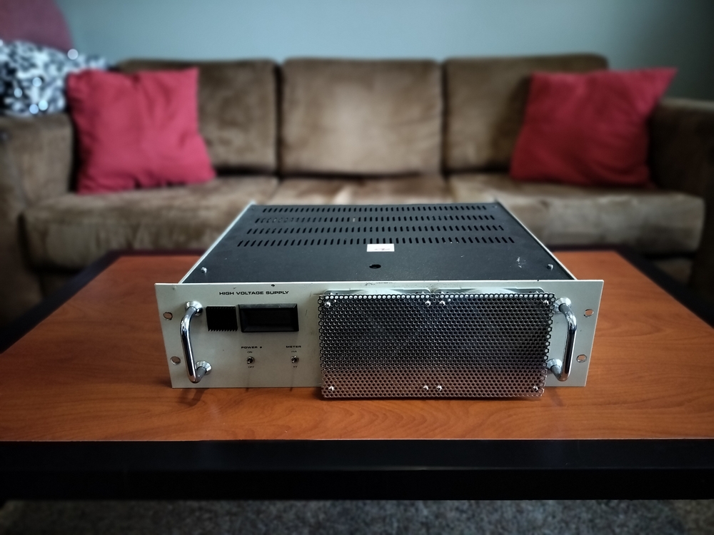 Custom rack chassis front view with external fans and metal mesh grill.