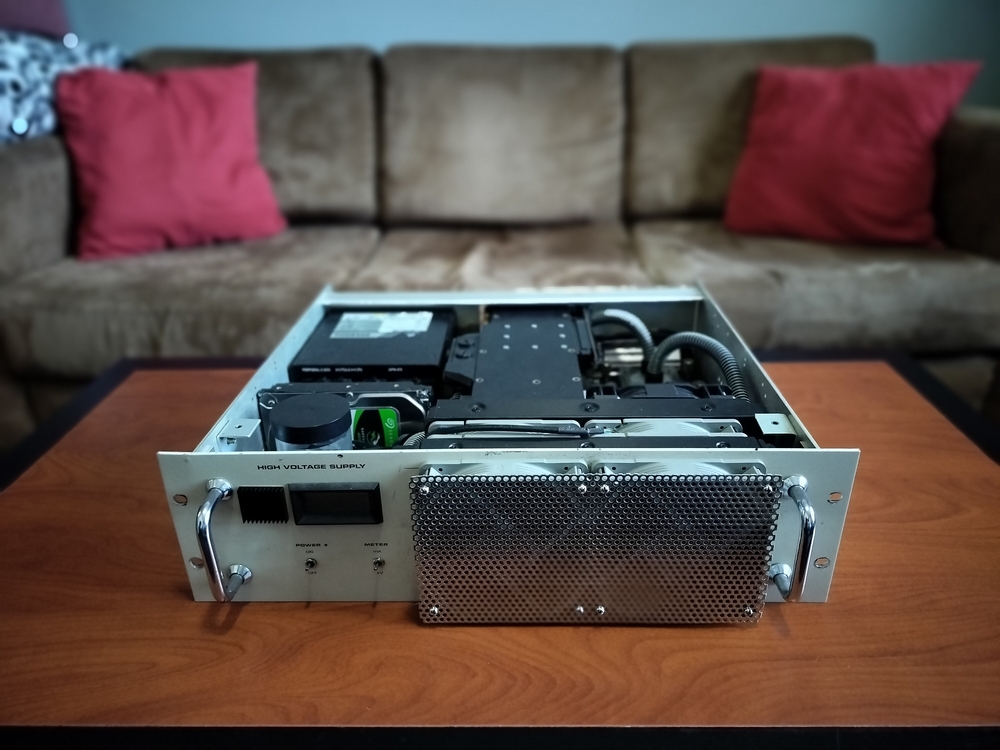 Front of the custom rack chassis with the top panel removed to expose the computer components.