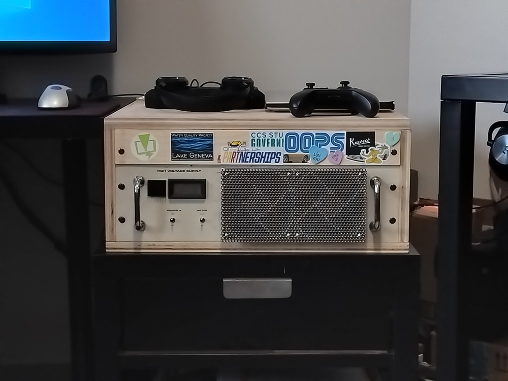 4U tall wooden computer/network rack ontop of an end table with a 3U tall computer and 1U wood blank mounted.