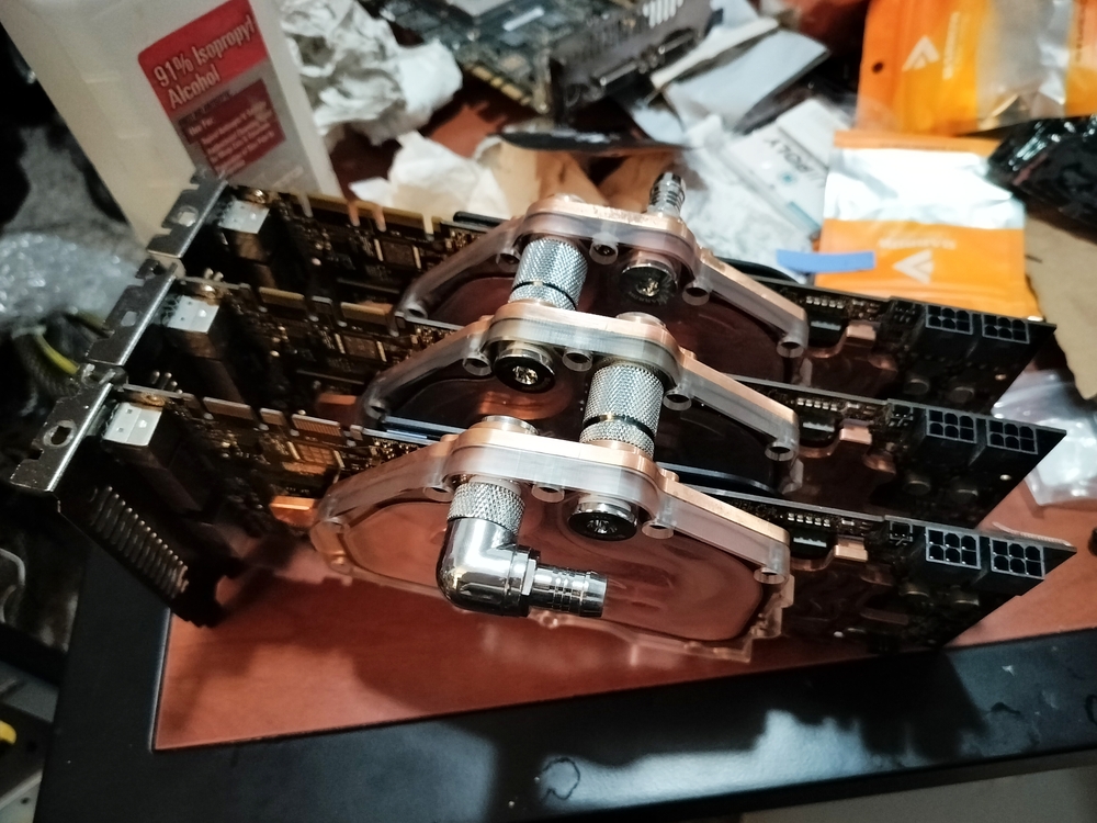 Three Nvidia GTX 260 GPUS with waterblocks and connected by extension fittings.